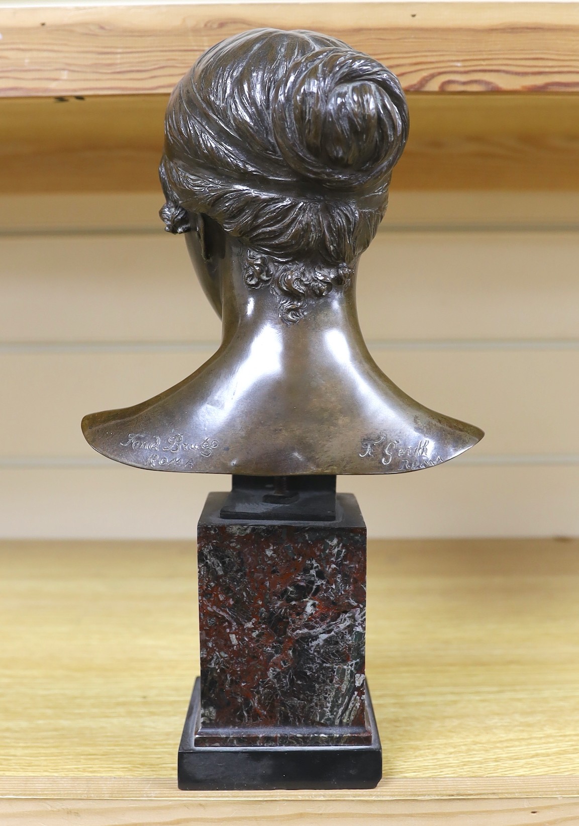 A small, signed Italian bronze bust, after the antique, signed 35cms high